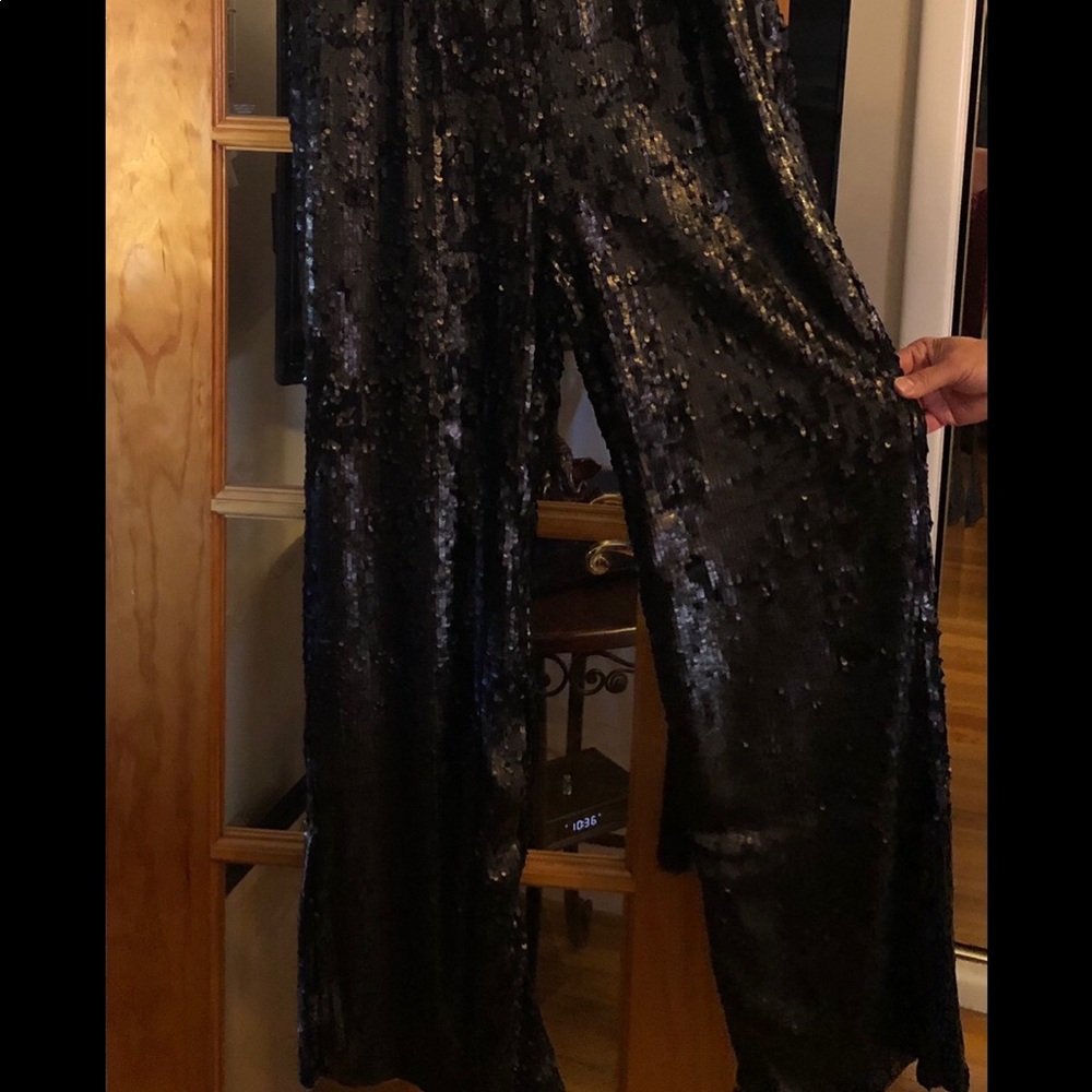 Beautiful V-neck beaded, wide leg jumpsuit.